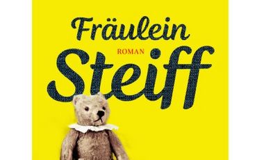 Buchcover von Maren Gottschalk: Fräulein Steiff. Gelber Hintergrund mit der Schrift und einem Foto des Steiff-Teddybären.