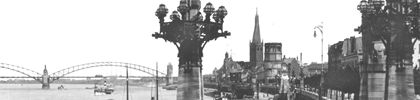 um 1905 | Rheinpromenade. Im Hintergrund die erste feste Rheinbrücke von 1898.