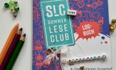 Foto mit SommerLeseClub Leselogbuch, Stiften und Buchstabenperlen