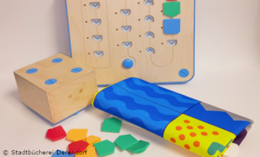 Cubetto Programmierspiel mit Spielbrett und Spielsteinen